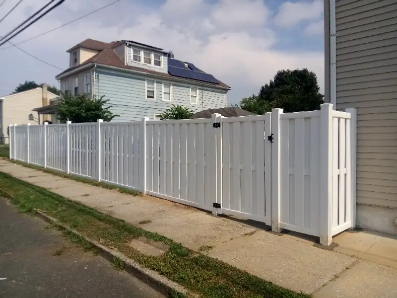 White vinyl residential fence installation by Fencing By Excellence near Hazlet, Monmouth County NJ