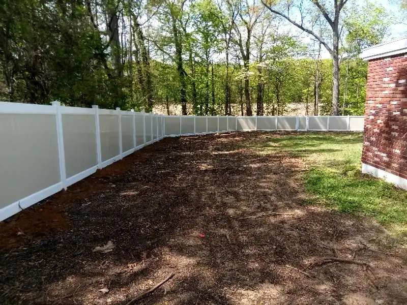 Scalloped vinyl picket fence installation by Fencing By Excellence near Freehold, Monmouth County NJ