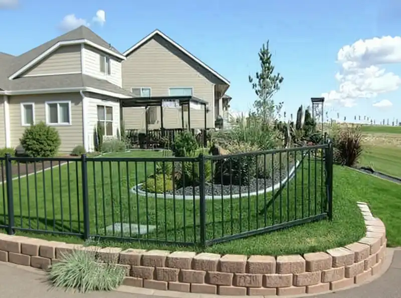 Black powder-coated aluminum fence with spear-top pickets around a pool area