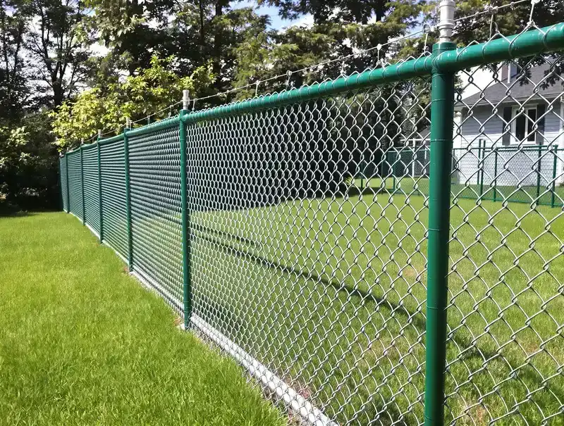 Galvanized chain link fence with vinyl-coated top rail around a commercial property