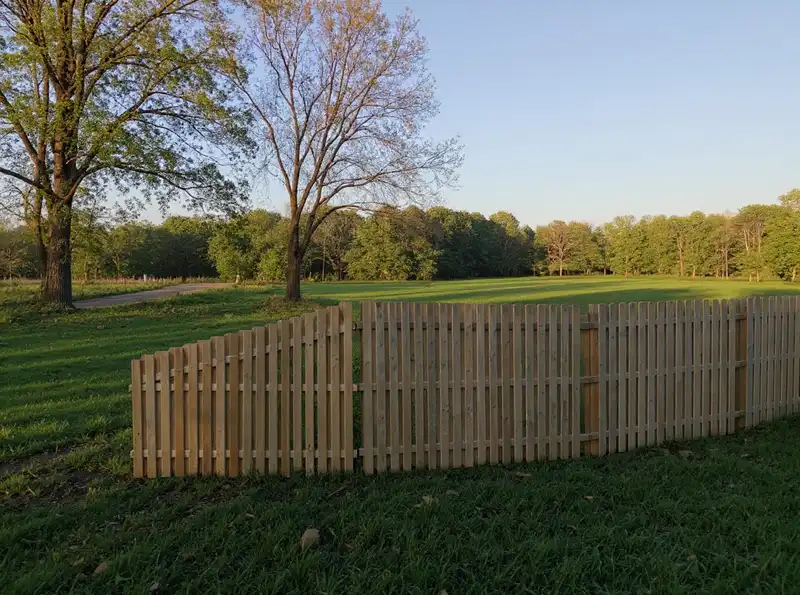 Three-rail wood split rail fence along a Monmouth County horse property